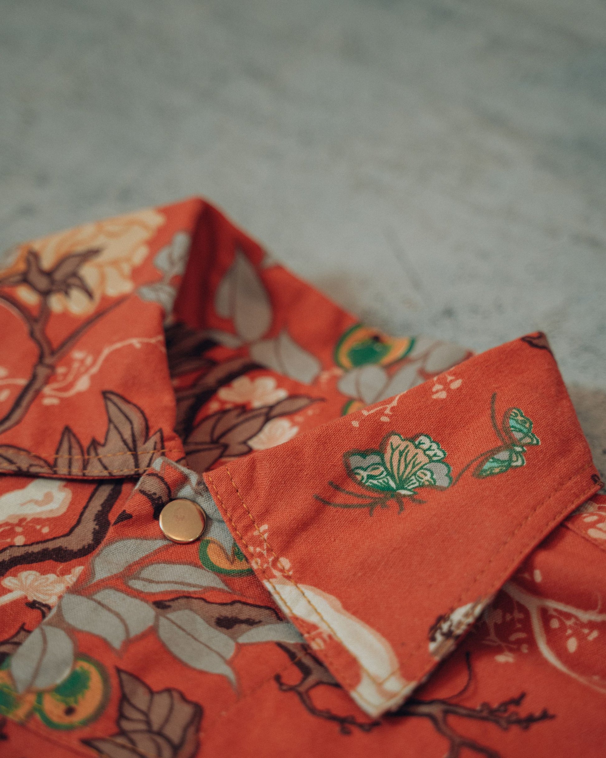 Close-up of a floral-patterned fabric of the upcycled jacket collar