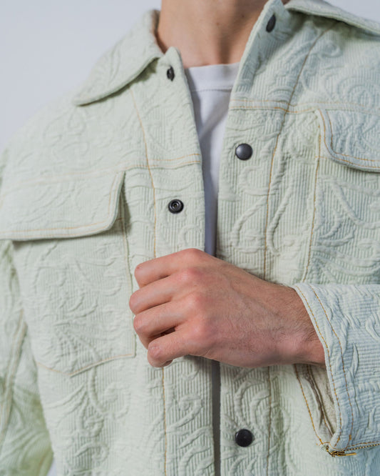 Light green sage textured jacket with black snaps made from upcycled fabrics