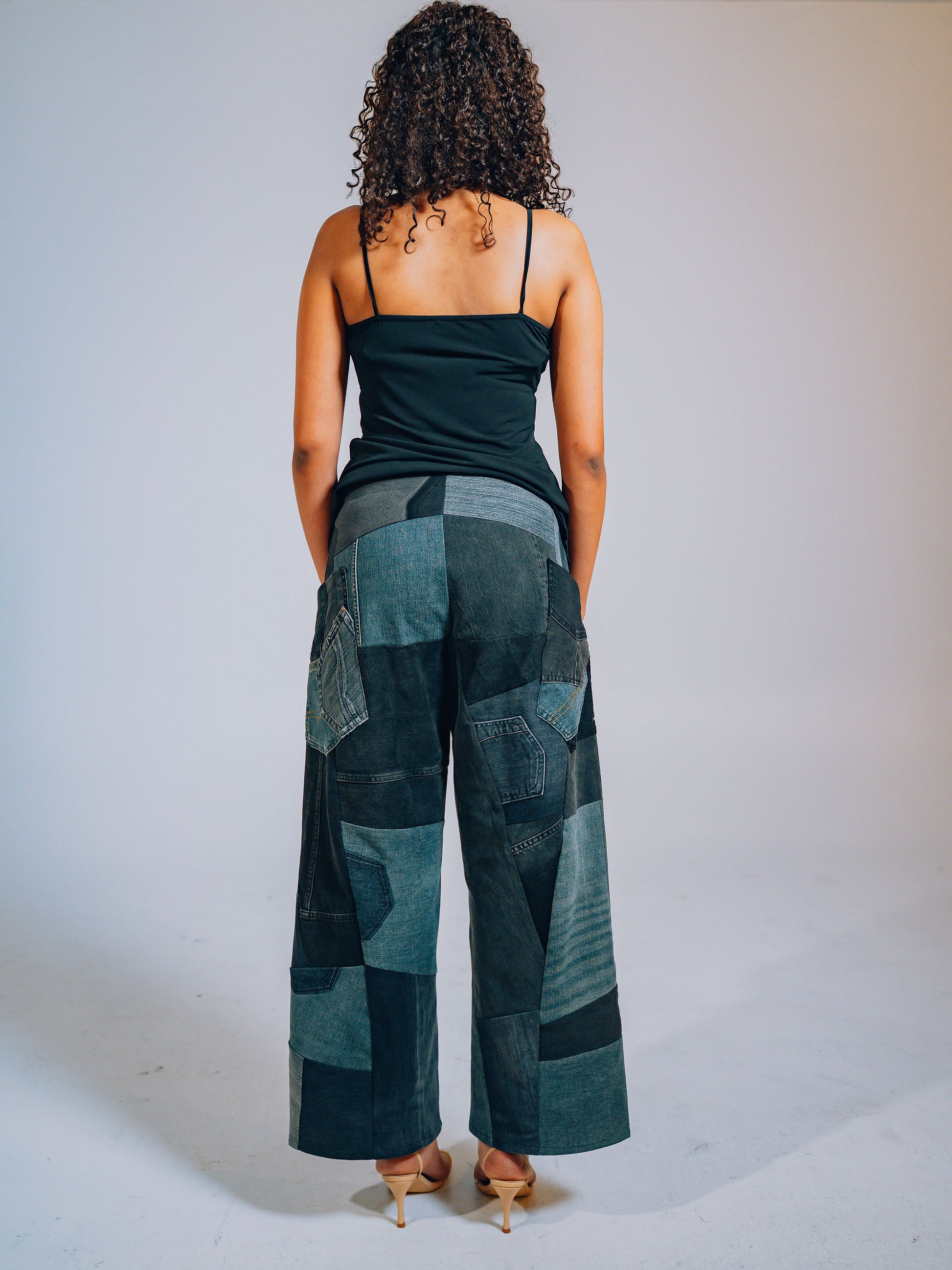 Person wearing upcycled patchwork pants 